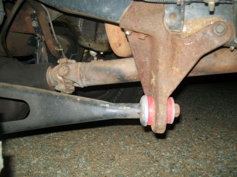 1995 Ford Bronco - Stock radius arm and hideously large dropped radius arm bracket .