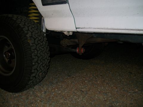 1995 Ford Bronco - Stock radius arm and hideously large dropped radius arm bracket .