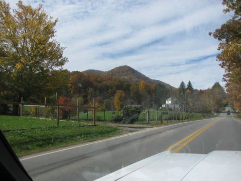 1985 Ford LTD Crown Victoria - A scenic drive through the countryside during autumn, with colorful trees and rolling hills.