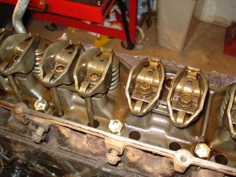 1991 Ford Bronco - The image shows the internal components of an engine, specifically the valve train, with rocker arms and pushrods visible.