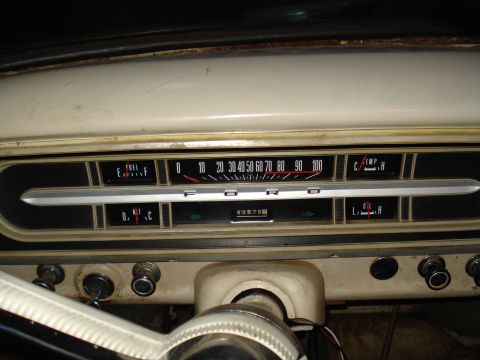 1967 Ford F-250 - Close-up of a vehicle's dashboard, showing various gauges and the odometer.