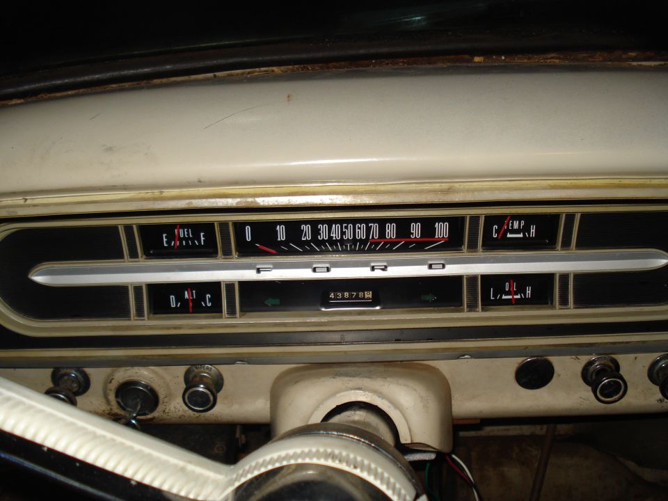 Dashboard with fuel, temp, oil gauges, and odometer reading 43878. Speedometer goes up to 100
