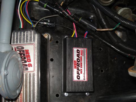 1984 Ford Bronco - Close-up view of aftermarket MSD ignition control modules and their associated wiring harness.