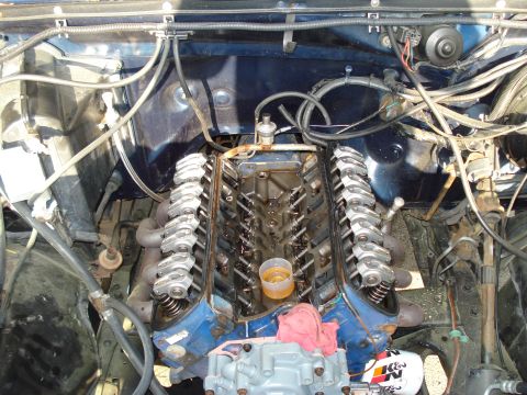 1984 Ford Bronco - Close-up view of a V8 engine's internal components, with valve covers off.
