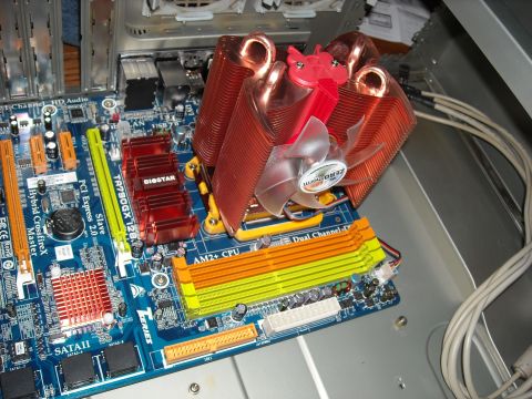 1979 Ford F-150 - A close-up view of a computer motherboard a large heatsink and fan assembly over the CPU socket.