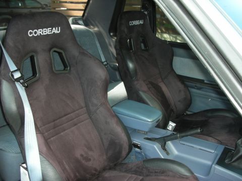 1990 Ford Mustang - The interior features Corbeau racing seats and a blue center console with a handbrake.