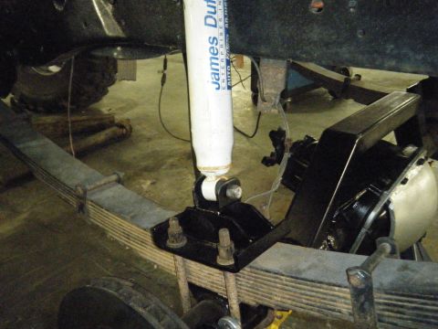 1978 Ford Bronco - Close-up view of the rear suspension system, leaf springs and a James Duff shock absorber.