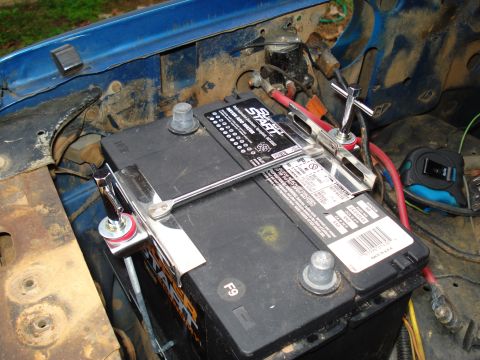 1967 Ford F-250 - Close-up of a vehicle's battery and its connected terminals, showing the Super Start brand.