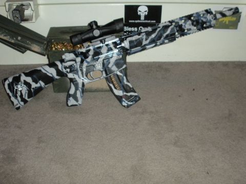 1996 Ford Bronco - An assault rifle with a unique camouflage pattern is displayed with ammunition nearby ammunition nearby ammunition nearby ammunition and am…