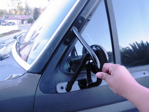 1986 Ford Bronco - Close-up of the side mirror assembly on a 1986 Ford Bronco.