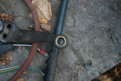 1987 Suzuki Samurai - Close-up view of a vehicle steering linkage component, possibly from a Suzuki Samurai, with associated hoses and wiring.