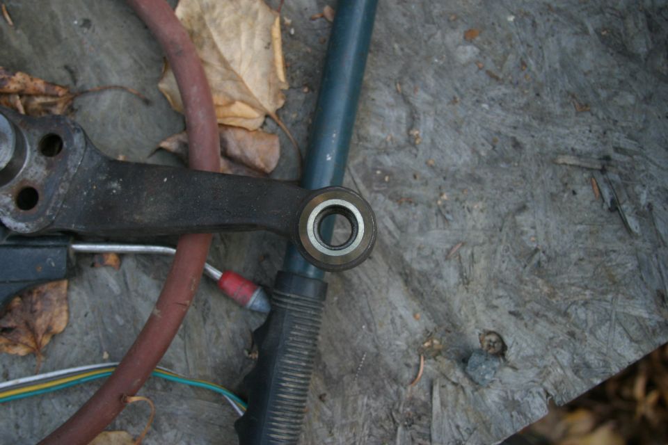 Steering linkage part with bearing and hoses