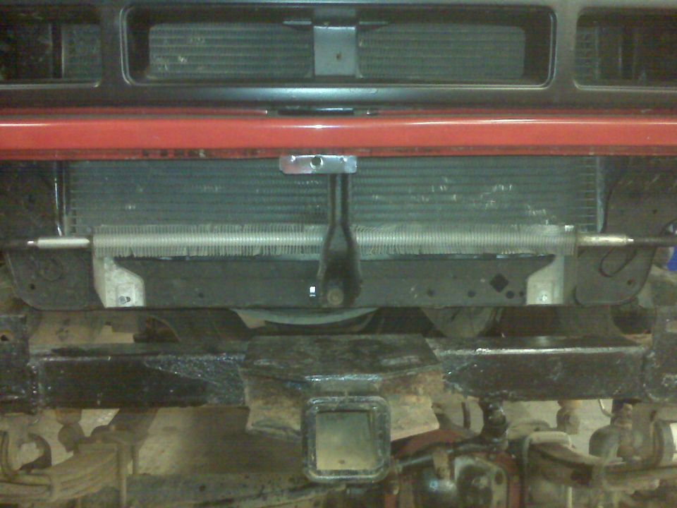 1994 Ford F-250 front end showing radiator, red bumper bar, and tow hitch receiver