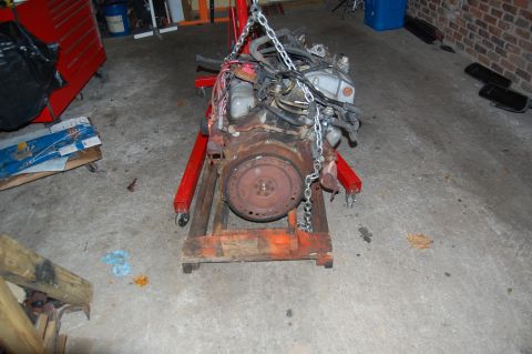 1994 Ford Bronco - Engine assembly on an engine stand, likely removed for repair or rebuilding.