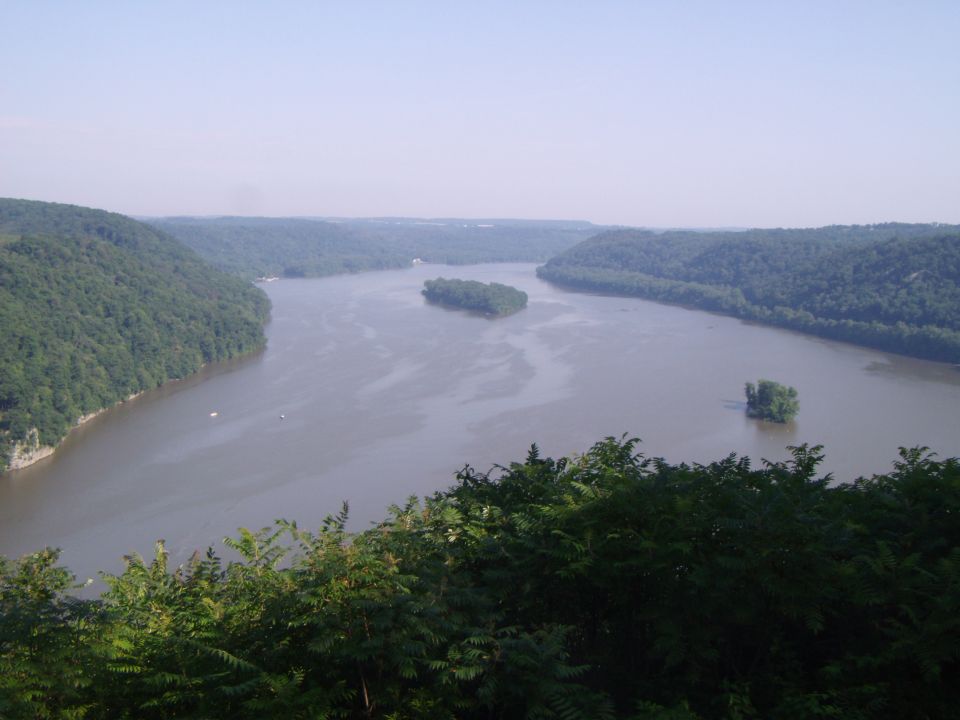 River scene with islands and trees, water reflects the sky