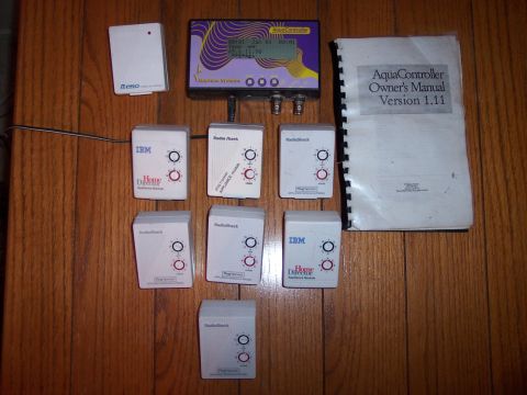 1996 Ford Bronco - This collection includes an AquaController, its manual, and various appliance modules from RadioShack and IBM.