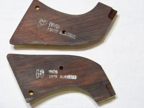 1995 Mercury Grand Marquis - These are two wooden trim pieces, possibly for a car interior, with some markings on them.