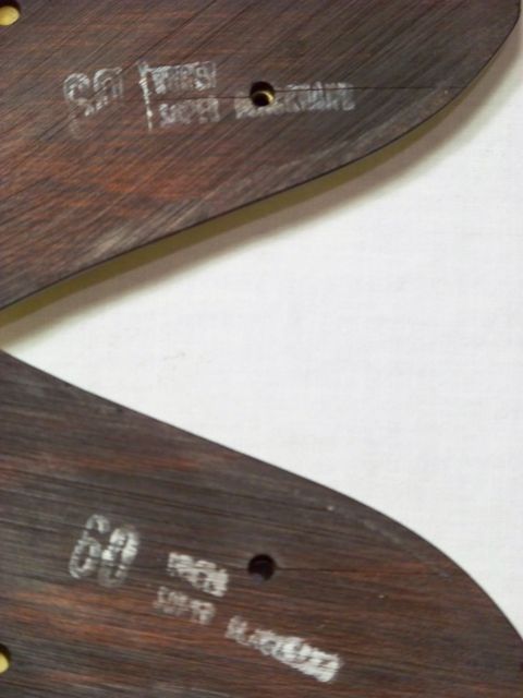 1995 Mercury Grand Marquis - Close-up of two wooden trim pieces with stamped identification marks.