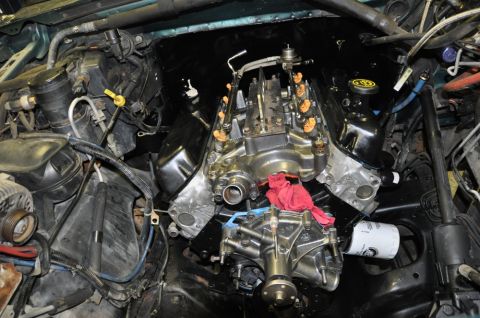 1996 Ford Bronco - Close-up view of a vehicle's engine components, including the fuel system and oil filter.