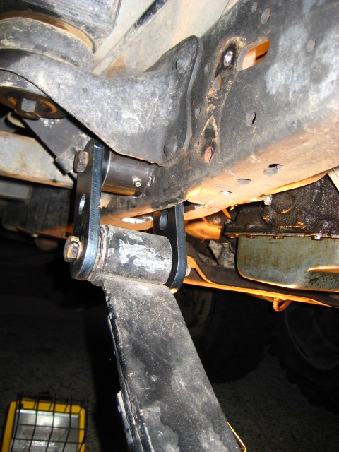 1989 Ford Bronco - Custom suspension components are installed on a vehicle's frame.