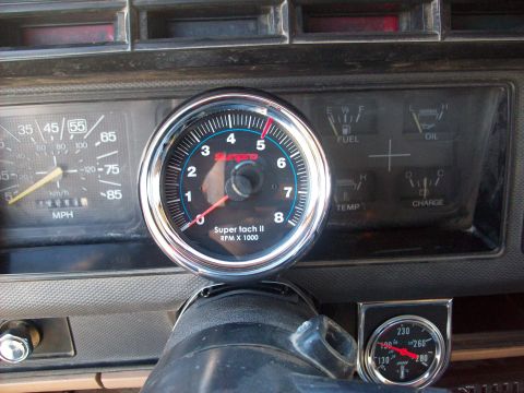1985 Ford Bronco - The dashboard displays a tachometer and other gauges, suggesting a vehicle from the early 1980s.