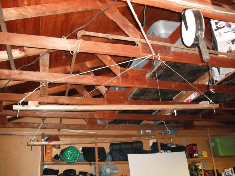 1991 Ford Bronco - A pulley system is rigged to the ceiling joists for storage in a garage.