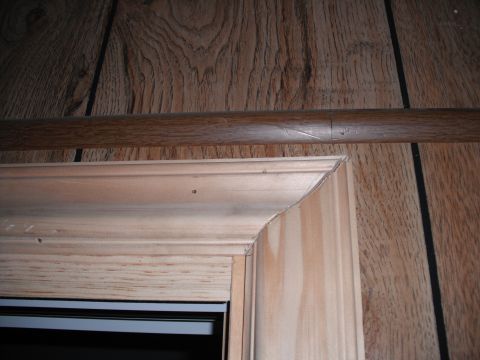 1991 Ford Bronco - Close-up view of an interior door frame, showing the raw wood and trim work.