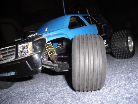 1991 Ford Bronco - RC car with blue body and black front end, "PROLINE" text visible on bumper.