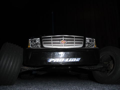 1991 Ford Bronco - This RC car features the front end of a Cadillac Escalade, complete with its distinctive grille and headlights.