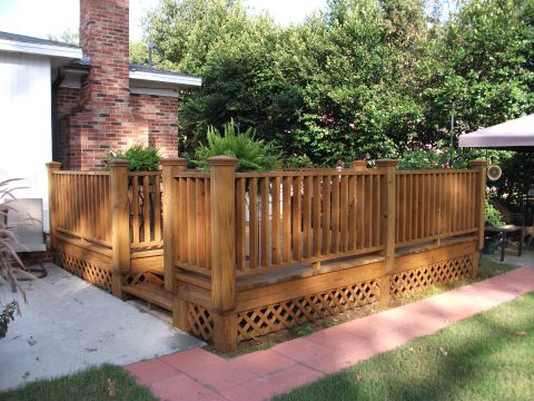 1992 Ford F-150 - A wooden deck and house exterior are shown in this outdoor scene.