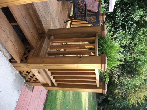 1992 Ford F-150 - Exterior view of a wooden deck with stairs, railing, and outdoor furniture.