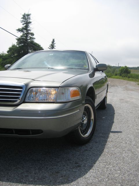 1999 Ford Crown Victoria - A 1998 Ford Crown Victoria is seen from a low angle on a paved road.