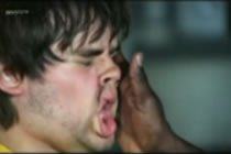 1988 Ford Bronco - A close-up of a person's face being struck by an open hand, captured mid-motion with the cheek visibly deformed by the impact.