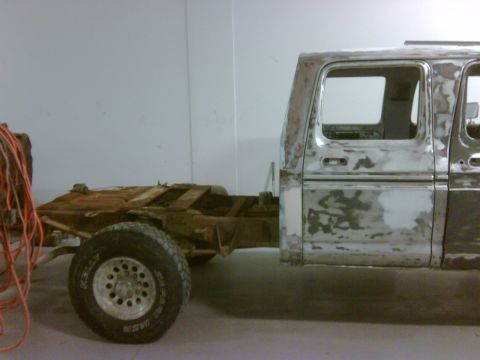 1979 Ford F-250 - This truck appears to be in the process of restoration, with primer and body filler visible on the cab.