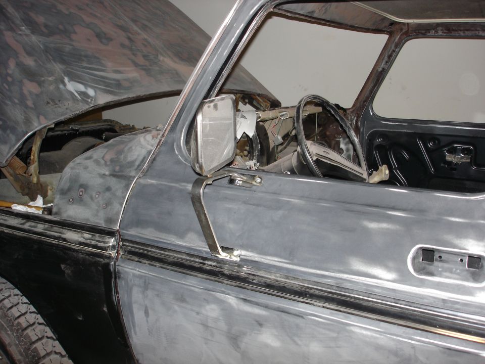 1979 Ford F-250 Crewcab interior showing steering wheel, door panel, and unfinished fender