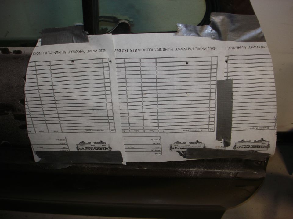 Paper with lines and text taped to the inside of a vehicle door