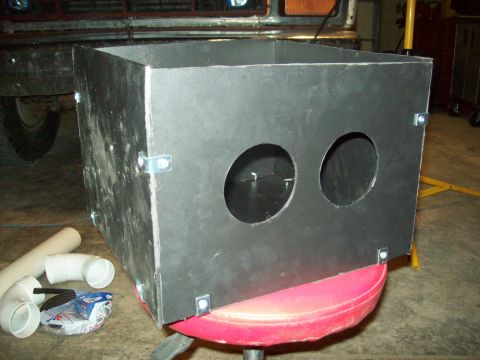 1985 Ford Bronco - A custom-fabricated metal enclosure with dual circular openings is shown, possibly for audio equipment or ventilation.