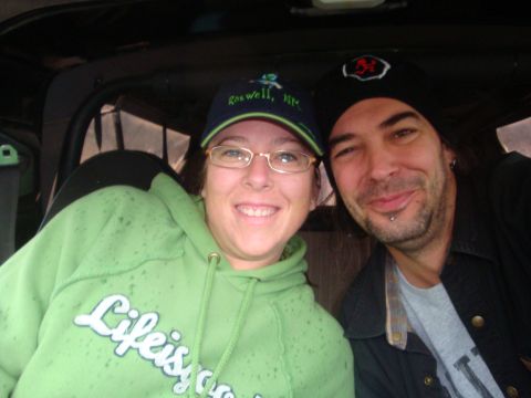 1978 Ford Bronco - A couple smiles for a selfie while sitting inside a vehicle.