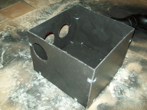 1985 Ford Bronco - This custom-made box has multiple circular openings and appears to be constructed from a dark material.