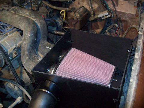 1985 Ford Bronco - Aftermarket K&N air filter installed in a custom black housing within the engine bay.