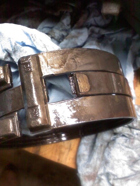 1977 Ford F-100 - This image shows a close-up of a greasy, metallic engine component, possibly a bearing or a part of the transmission.