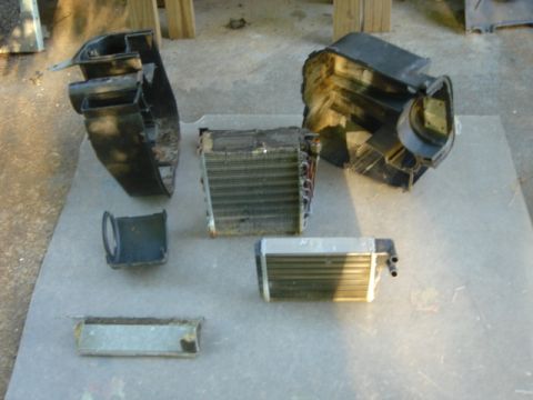 1983 Volkswagen Rabbit - the internals: left and right heater case halves, A/C evaporator, motor shroud, heater core, and defrost deflector.