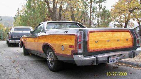 1973 Ford Ranchero - The tailgate of a 1973 Ford Ranchero features wood grain paneling with 'FORD' spelled out in individual letters.