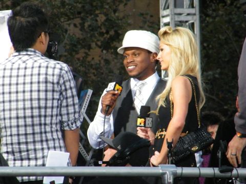 1982 Ford Bronco - Media personnel interview guests at an outdoor event, with MTV microphones visible.