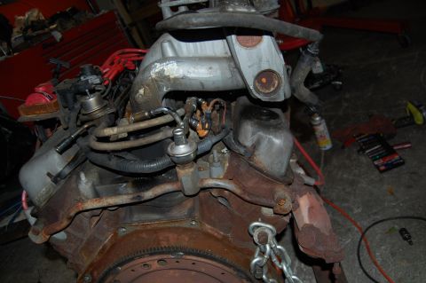 1994 Ford Bronco - Close-up view of an engine block, showing fuel lines and distributor assembly.