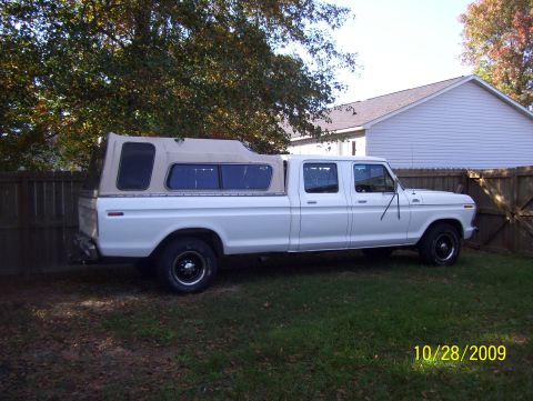 1978 Ford Bronco - This 1975 Ford F-350 crew cab pickup truck is equipped with a camper shell.