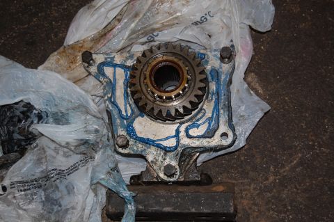 1994 Ford Bronco - Close-up of a transfer case part, possibly from a 1994 Ford Bronco, with a gear visible.