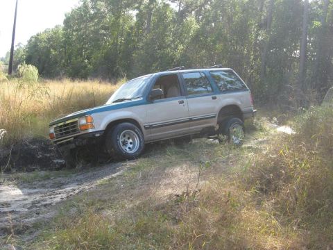 1992 Ford Explorer - This 1992 Ford Explorer is navigating a challenging off-road terrain.