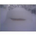 1973 Ford Ranchero - A vehicle is obscured by a thick layer of snow, making identification impossible.