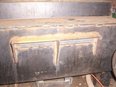 1995 Ford C-350 (Centurion Conversions) - A custom-fabricated metal fuel tank with visible welding and access hatches is shown.